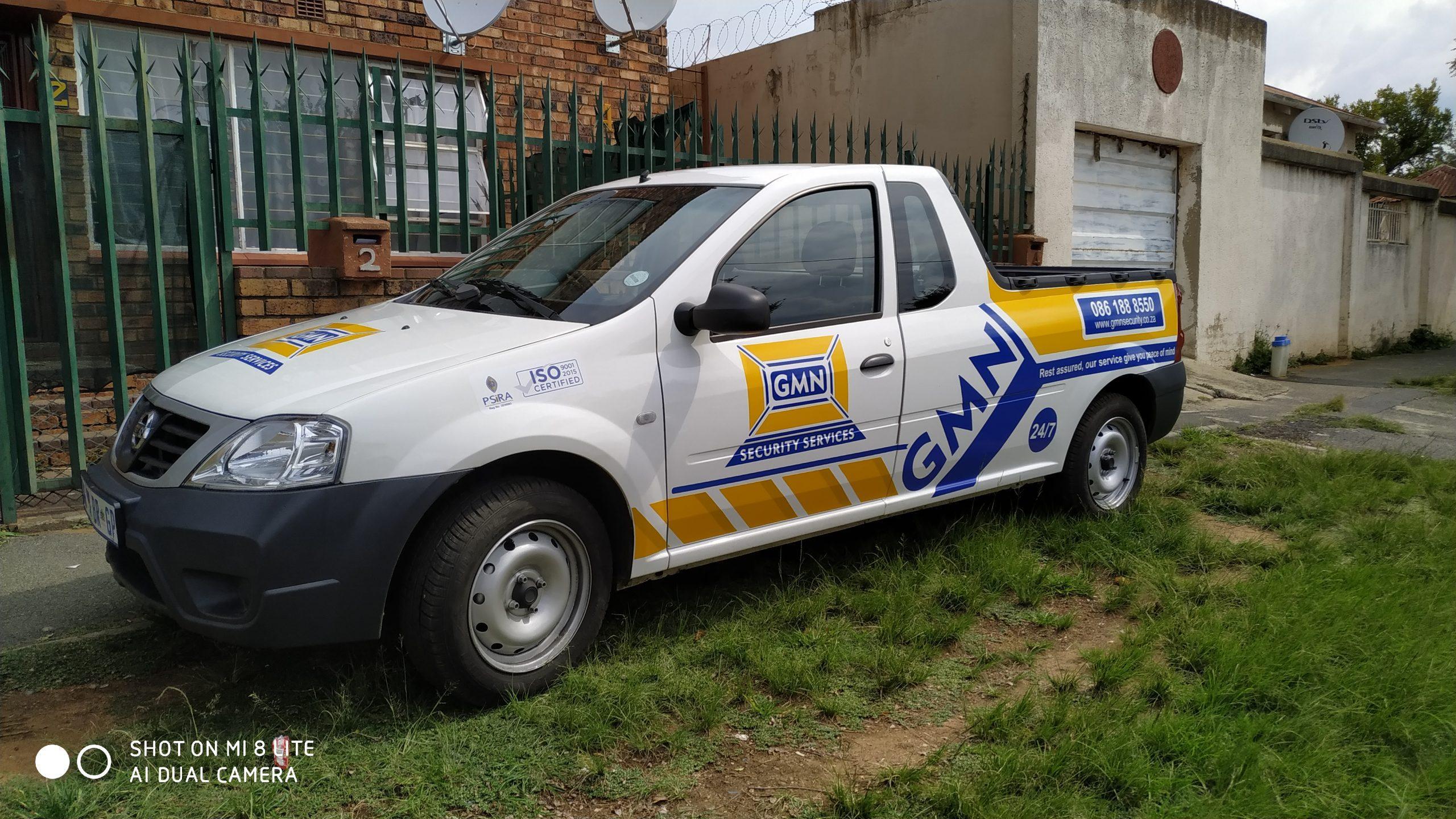 Custom vehicle branding by Masproclean Branding and Signage, featuring vibrant graphics and logos on a vehicle designed for effective mobile advertising