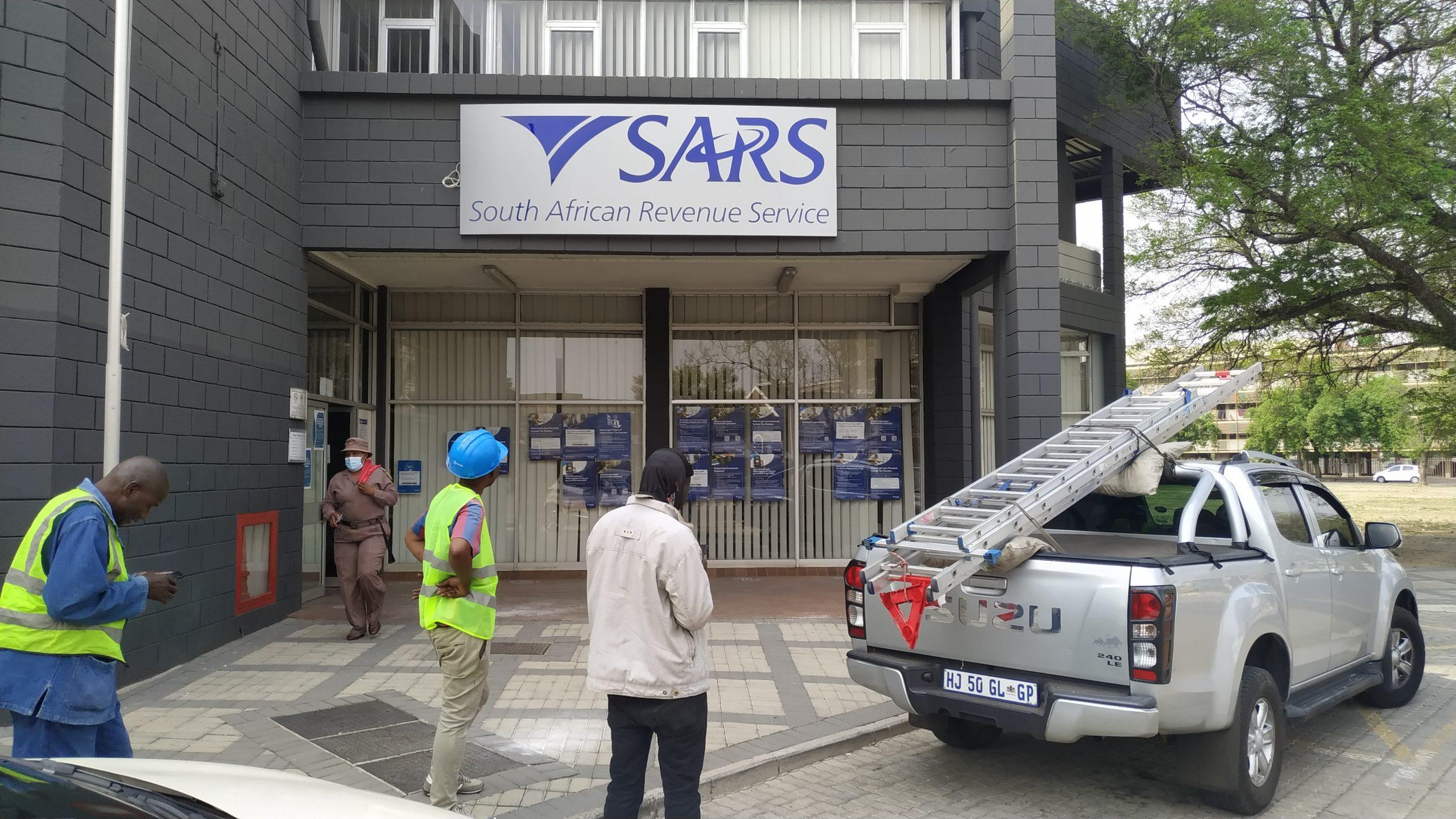 "Installation of lightbox signage by Masproclean Branding and Signage, showcasing illuminated graphics that enhance visibility and attract attention for businesses, day or night